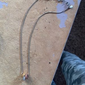 Silver necklace with rose gold, silver, and gold beads for $5